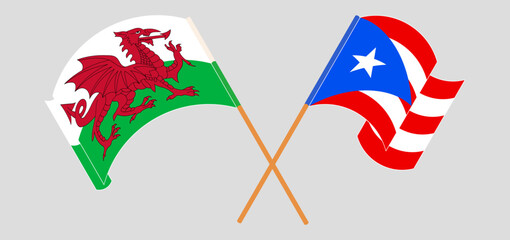 Crossed and waving flags of Wales and Puerto Rico