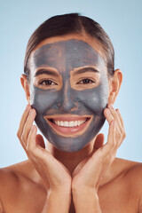 Woman, face mask and charcoal for beauty, skincare and natural cosmetics cleaning product on studio, blue background. Portrait of person or model in facial collagen and mud skin care for dermatology