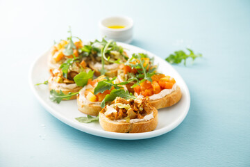 Healthy crostini with pumpkin and mushroom