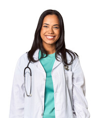 Young Filipina doctor with stethoscope in studio happy, smiling and cheerful.