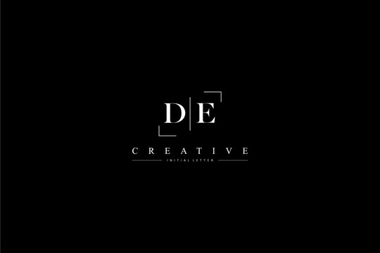 minimalist DE initial logo with simple vertical stroke line in black 110323