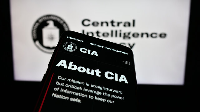 Stuttgart, Germany - 10-29-2023: Smartphone with webpage of US Central Intelligence Agency (CIA) in front of seal. Focus on top-left of phone display.
