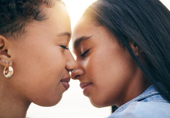 Lgbtq couple, love and intimate at sunset outdoor, bonding and romance on date together. Partner, gay women and nose touch for care, commitment and loyalty, trust and support for lesbian people