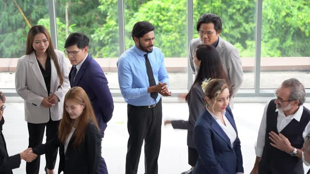 group of diverse business team building standing and talking and introduce yourself after meeting in seminar conference . Multicultural business people discussing or having a conversation