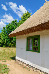 Small cozy houses. Wooden ancient buildings. Summer village and vacation. Farm bio products. - 672117793