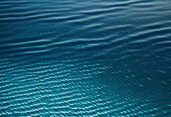 Fototapeta na wymiar surface of blue water texture background from upper view in minimal style