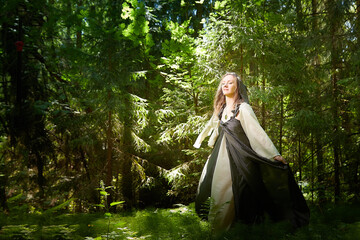 Beautiful seductive dryad. Pagan spirit of the forest. Portrait of beautiful dryad. Fairy who loves...