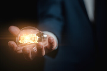 investment and finance concept, businessman holding virtual trading graph and blurred light on hand, stock market, profits and business growth.