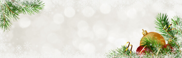 Holiday background with pine twigs and Christmas decorations