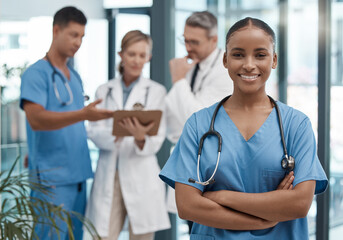 Doctor, team and portrait of black woman in the hospital or clinic and smile on face. Teamwork,...