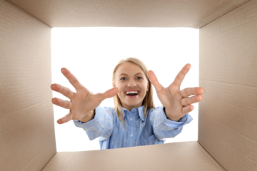 PNG,The girl looks into a cardboard box, isolated on white background