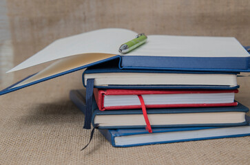 a ctack of notebooks folded on the table.education concept. close-up