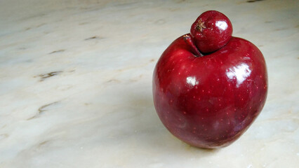 Big red apple mother and little apple daughter a happy family of fresh fruit creative idea