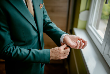 A young businessman is getting dressed
 for a meeting. The beginning of a new working week.


