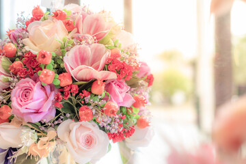 Celebrate Artificial bouquet  flowers close-up. Decoration of roses, flowers and ornamental plants, modern and luxury artificial bouquet of colorful flowers for graphic design.