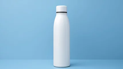 Fotobehang blank white water bottle isolated on blue background mock-up © TANBIR