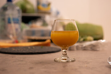A glass of orange juice on the table