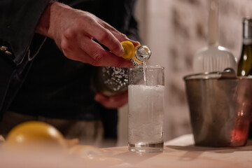A barmen prepares a soft drink