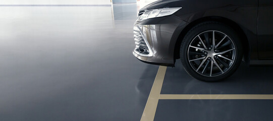 modern car in parking lot, anti slip coating floor for safety, car parked in the right position in...