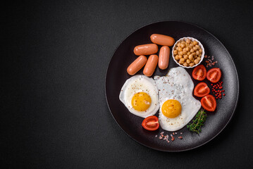 Fried chicken eggs, sausages, cherry tomatoes, chickpeas, spices, salt and herbs