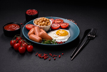 Fried chicken eggs, sausages, cherry tomatoes, chickpeas, spices, salt and herbs