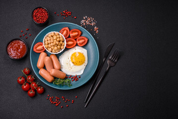 Fried chicken eggs, sausages, cherry tomatoes, chickpeas, spices, salt and herbs