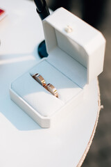 two wedding rings in a box