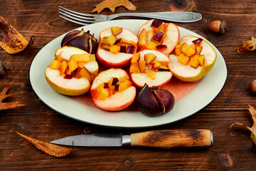 Plate of baked apple slices and figs