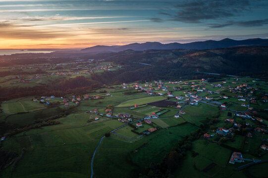 Golden Horizon: Aerial Sunset View of Asturias Coastline