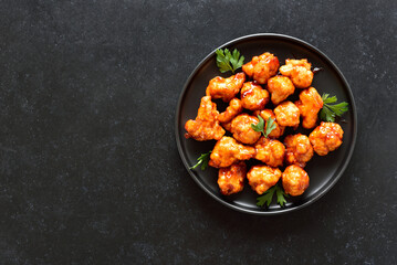 Sweet chili cauliflower wings on plate