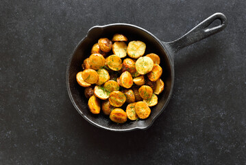 Roasted potatoes in frying pan