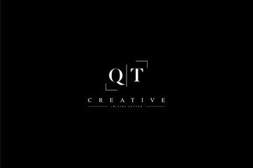 minimalist QT initial logo with simple vertical stroke line in black