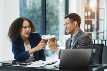 Happy creative business people holds a cup of coffee and smiles happily.
