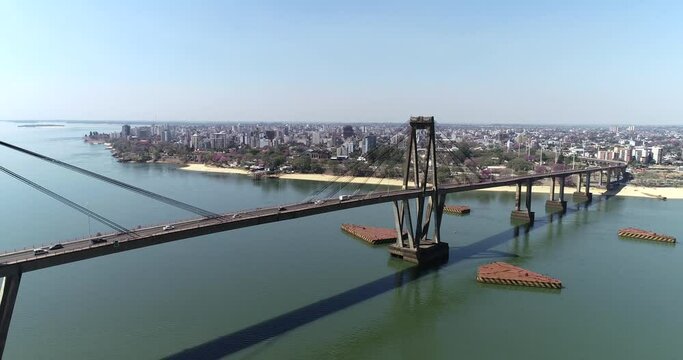 Bird's-eye view of the Puente General Manuel Belgrano, the Paran&aacute; River, and the city of Corrientes in the background.