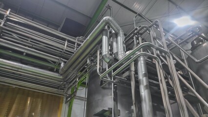 Stainless stainless pipe to flow water and product and tank in production room of factory	