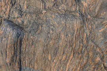Pattern background of granite stone. Wavy uneven lines with breaks. unequal structures become...