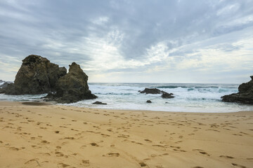 Fototapeta na wymiar Beautiful Samoqueira beach on a stormy and windy day in Porto Covo