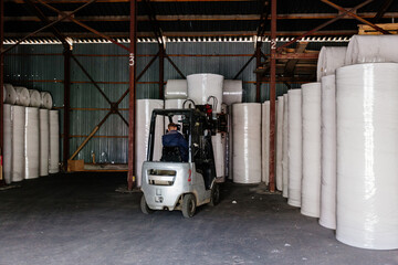 Rolls of recycled paper in the warehouse