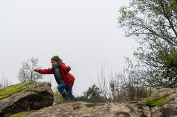 Happy boy running in nature