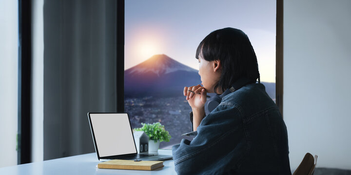 Blank Screen Of Man Hand Working On Laptop Computer And Peper Work While Sitting At The Table, Mockup Blank Screen For Product Display Or Graphic Design