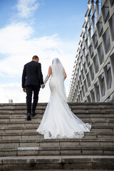 happy bride and groom posing on their wedding day