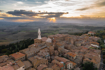 A captivating aerial view of a picturesque town in the heart of southern Tuscany, Italy. This drone-captured image showcases the charming beauty of Italian architecture, narrow streets, and a historic - 672172134