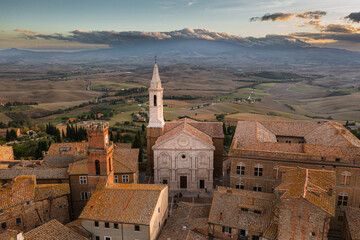 A captivating aerial view of a picturesque town in the heart of southern Tuscany, Italy. This drone-captured image showcases the charming beauty of Italian architecture, narrow streets, and a historic - 672172158