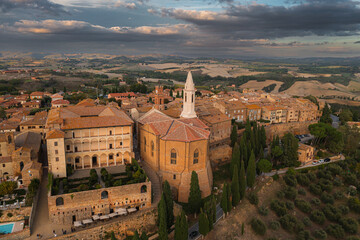 A captivating aerial view of a picturesque town in the heart of southern Tuscany, Italy. This drone-captured image showcases the charming beauty of Italian architecture, narrow streets, and a historic