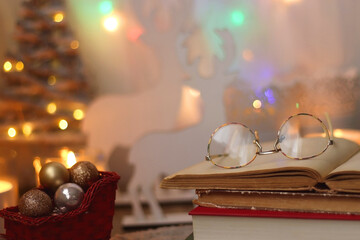 Bowl of cookies, cup of tea, dry oranges, pine cones, books, reading glasses, small presents,...