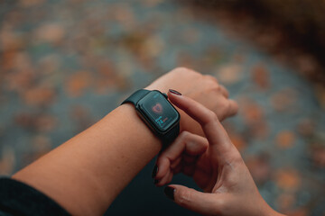 Smart Watch Showing Heartbeat Monitor On Woman Hand