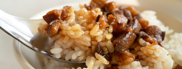 Braised meat over cooked rice, famous and delicious street food in Taiwanese restaurant.