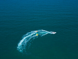 Sea attraction view from above. A boat takes tourists around the sea. Italy, Rimini