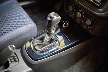 Car shift lever. Inside a modern car view, city car interior background