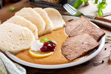 Svickova - Traditional czech dish: Marinated beef sirloin with creamy root vegetable sauce and...